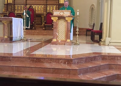 Father Pollard Reading the Gospel at St. Stephen