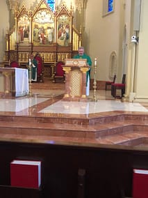 Father Pollard Reading the Gospel at St. Stephen